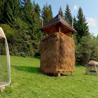Summer rest in Carpathians, hammocks by the pool in the hotel Vezha Vedmezha