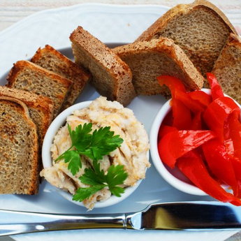 Ukrainian appetizer: salo, pickled peppers and toasted bread