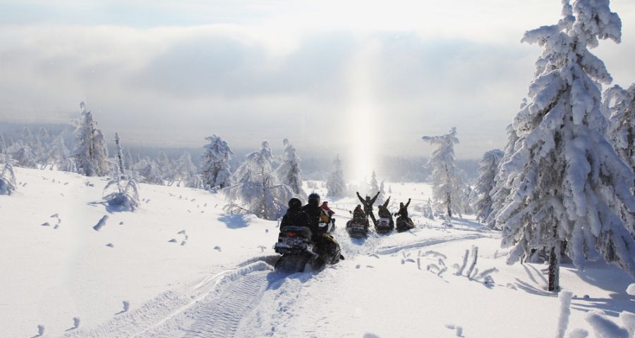 Travel snowmobiling in winter Carpathians
